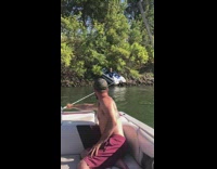 Boat pulls stuck boat from trees