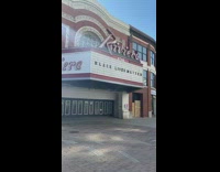 Girl red shirt Riviera theater black van