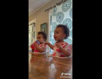 Mom asks baby to say peppa pig in high chair