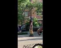 Guy wears a TV monitor on his head as a costume 