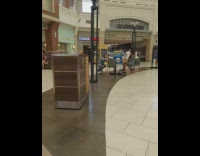 Black striped dress girl sits chair mall 