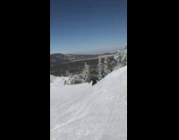Guy blue plaid shirt frontflips off ramp on snowboard and fails