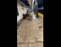 Collab winy - Man with umbrella under subway ceiling leak