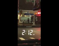 Guy outside closed restaurant looks down chase