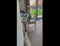 Baby boy toddler climbs on chair 