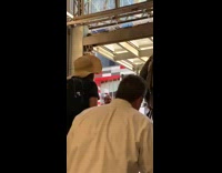 Man plays guitar and sings about vaginas at the top of escalators at station