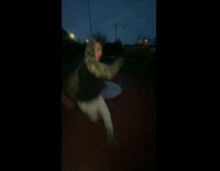 Two guys spinning on playground 