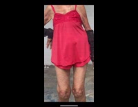 Grandma dances to music in pink mini dress