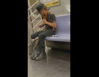Man sharpens his knives on train