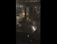 Two guys outside with blue glow sticks 