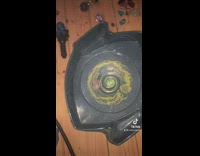 Beyblade match interrupted by red toy truck