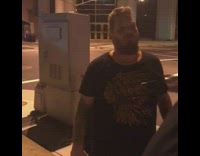 guy black shirt throwing up on street 