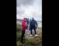 Man drinks beer lets wind fly beer into his mouth