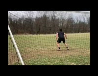 guy black shorts kicks soccer ball in his face