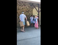 Man dance holding two wine boxes barrel