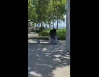 Guy has his snake while on bench