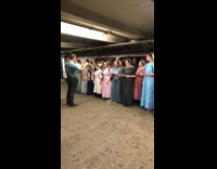An amish choir singing at subway station at bronx
