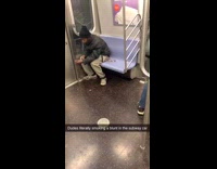 Collab Subway Creatures - Guy black beanie smokes a blunt in corner of subway train