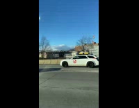 White car with ghostbusters decal on door