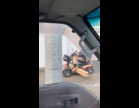 Elderly man transporting timber on mobility scooter 