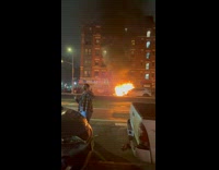 Collab WINY - Man Poses for Picture as Car Burns