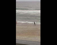 Father and son run at the beach towards the camera Part 2