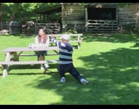 Outdoor cabin photoshoot FILA sweater