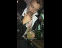 Music Guy in nightclub puts finger in drink and spins it around 