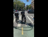 Small bag hangs off bicycle seat