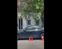 Collab WINY - Charger cable of tesla from apartment window