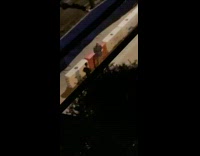 Two men photo shoot nighttime orange traffic barrier Part 1