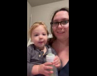 Baby girl imitates mom making funny faces