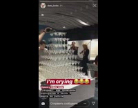 Guy knocks down champagne pyramid tower