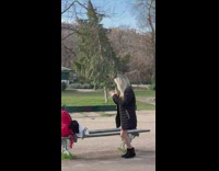Lady in Fit Long Blouse Dances Besides Eiffel Tower
