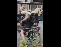 Man get off motorcycle dog in bag