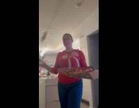 Woman carrying pizza box and pizza falls