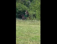 Green skirt girl white paper fan grass