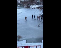 People ignores danger sign stands at pond