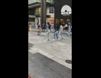 Four women jean jacket group dance on the street