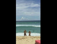 Woman beige bikini brown cowboy hat beach