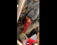 Man red pants with boner on subway train