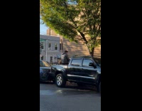 Man playing piano at back of truck 