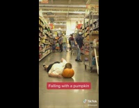 Guy falls and smashes pumpkin 