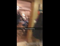 Guy meditating in his living room with dog looking at him