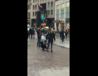 Guy takes photo of shoes