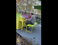 Man Play Piano at Colorful Public Park