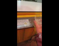 Girl test sign drink slides off ledge 