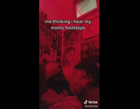 Guy in red room pretending to be asleep