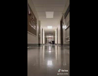 Guy slides down hallway