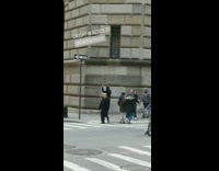 man throws bottle over car bin